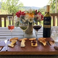 Amista Vineyards Wine & Cheese Pairing with Flowers & Vineyard Views