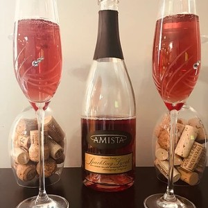 Amista Vineyards Sparkling Syrah, Two Festive Glasses with Bottle and Corks